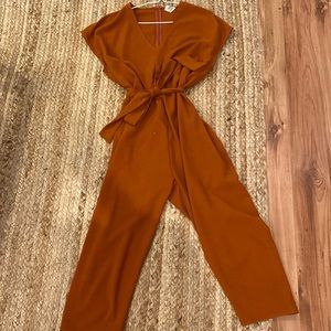 Adorable orange romper with tie. Size S